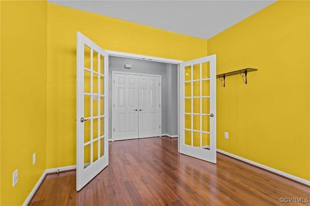 8334 E Lord Botetourt Loop, New Kent, VA 23124 - spare room with french doors and wood finished floors