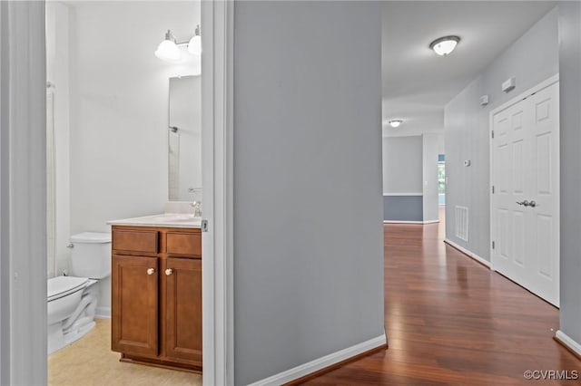8334 E Lord Botetourt Loop, New Kent, VA 23124 - corridor with wood finished floors and baseboards