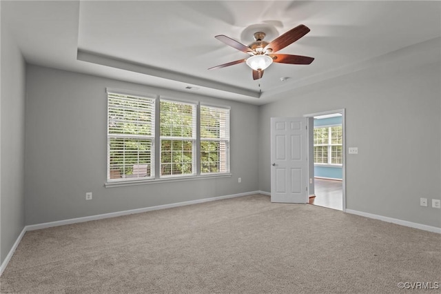 8334 E Lord Botetourt Loop, New Kent, VA 23124 - empty room featuring a raised ceiling, ceiling fan, and carpet floors