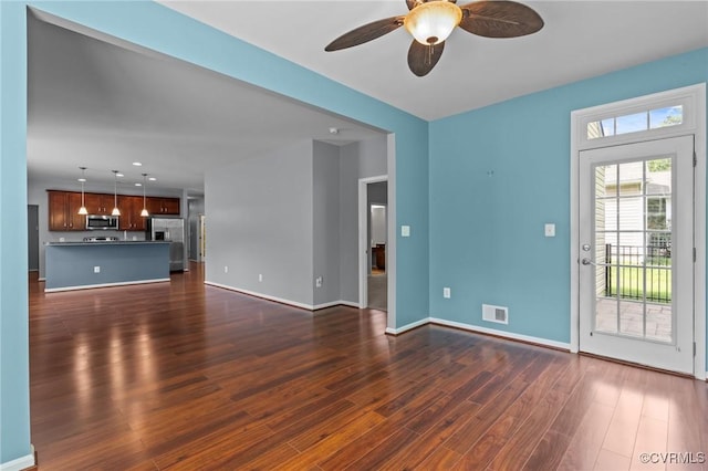8334 E Lord Botetourt Loop, New Kent, VA 23124 - unfurnished living room featuring dark wood-type flooring, a ceiling fan, and recessed lighting