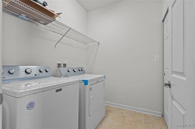 8334 E Lord Botetourt Loop, New Kent, VA 23124 - laundry room featuring washing machine and clothes dryer and baseboards