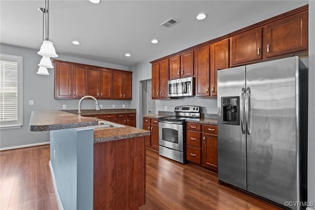 8334 E Lord Botetourt Loop, New Kent, VA 23124 - kitchen with appliances with stainless steel finishes, dark wood-style flooring, recessed lighting, and decorative light fixtures