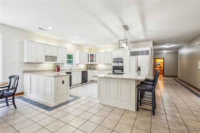 6002 Prospectors Bluff Ln, Mechanicsville, VA 23116 - kitchen with paneled built in refrigerator, light tile patterned floors, white cabinetry, recessed lighting, and pendant lighting