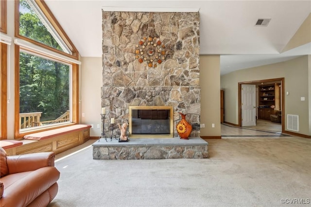 6002 Prospectors Bluff Ln, Mechanicsville, VA 23116 - unfurnished living room with vaulted ceiling, carpet floors, and a stone fireplace