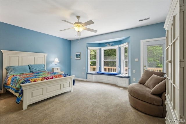 6002 Prospectors Bluff Ln, Mechanicsville, VA 23116 - carpeted bedroom featuring multiple windows, access to exterior, and a ceiling fan