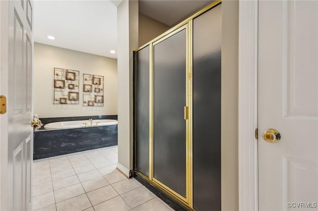 6002 Prospectors Bluff Ln, Mechanicsville, VA 23116 - bathroom with tile patterned floors, a garden tub, a shower stall, and recessed lighting