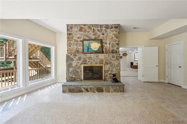6002 Prospectors Bluff Ln, Mechanicsville, VA 23116 - unfurnished living room featuring healthy amount of natural light, tile patterned flooring, and a fireplace