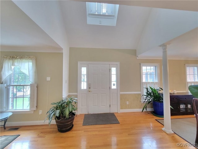 231 White Sand Ct, Colonial Heights, VA 23834 - foyer entrance featuring ornate columns, light wood-type flooring, lofted ceiling, and crown molding