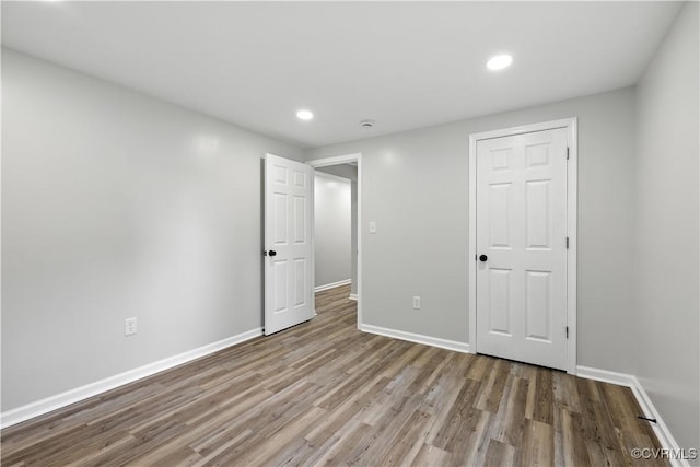 22805 Carson Rd, Carson, VA 23841 - unfurnished bedroom with wood finished floors and recessed lighting