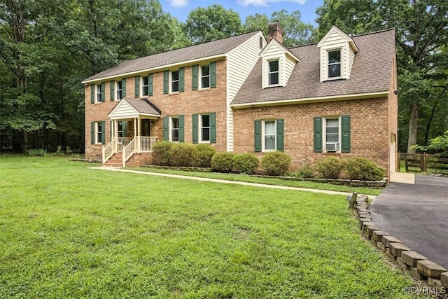 13241 Bailey Bridge Rd, North Chesterfield, VA 23112 - colonial inspired home with brick siding, a chimney, a shingled roof, and driveway