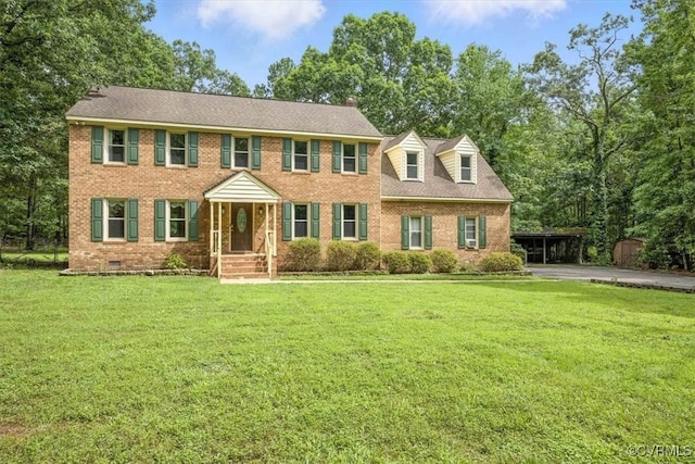 13241 Bailey Bridge Rd, North Chesterfield, VA 23112 - colonial home with brick siding, a front lawn, a carport, and crawl space
