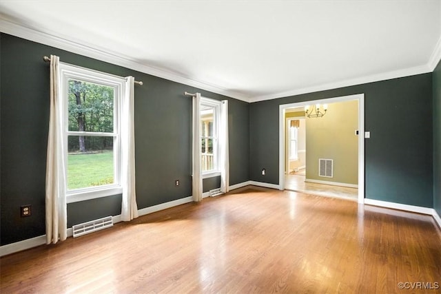 13241 Bailey Bridge Rd, North Chesterfield, VA 23112 - spare room with a chandelier, crown molding, and wood finished floors