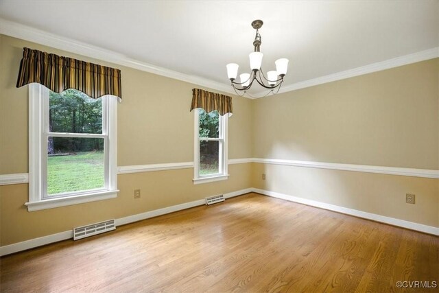 13241 Bailey Bridge Rd, North Chesterfield, VA 23112 - unfurnished room with a chandelier, healthy amount of natural light, wood finished floors, and ornamental molding