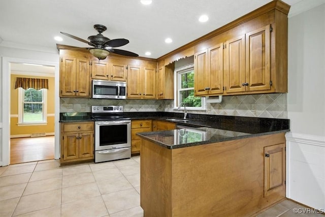 13241 Bailey Bridge Rd, North Chesterfield, VA 23112 - kitchen featuring stainless steel appliances, a peninsula, brown cabinets, ornamental molding, and ceiling fan