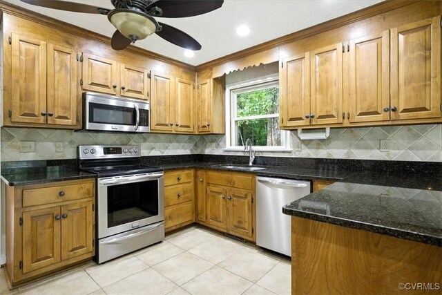 13241 Bailey Bridge Rd, North Chesterfield, VA 23112 - kitchen featuring stainless steel appliances, brown cabinetry, and light tile patterned floors