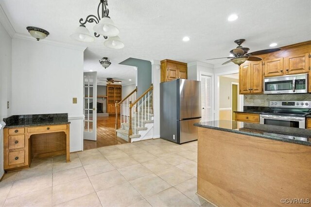 13241 Bailey Bridge Rd, North Chesterfield, VA 23112 - kitchen with stainless steel appliances, a ceiling fan, decorative backsplash, dark stone counters, and crown molding