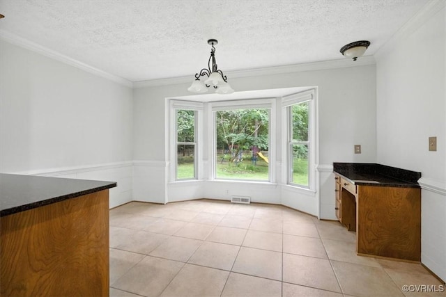 13241 Bailey Bridge Rd, North Chesterfield, VA 23112 - unfurnished dining area with ornamental molding, a textured ceiling, light tile patterned flooring, and a chandelier