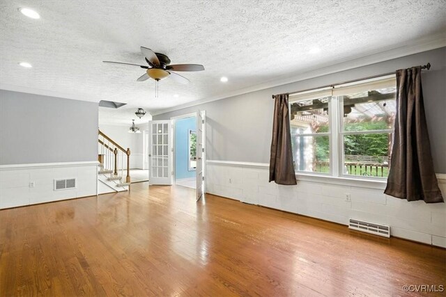 13241 Bailey Bridge Rd, North Chesterfield, VA 23112 - unfurnished room with stairway, a textured ceiling, wood finished floors, ceiling fan, and crown molding