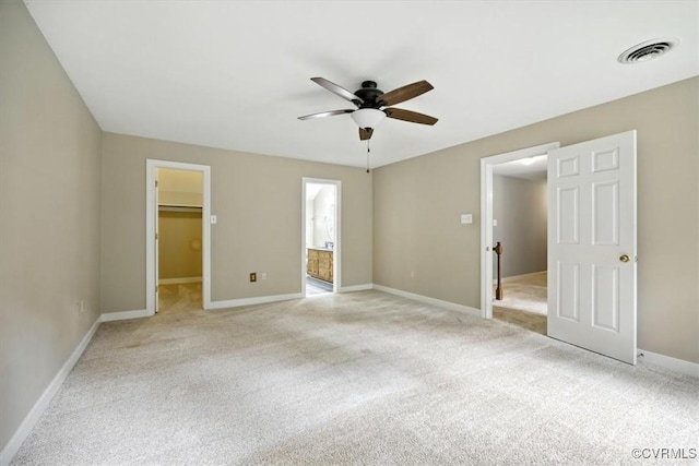 13241 Bailey Bridge Rd, North Chesterfield, VA 23112 - unfurnished bedroom featuring light colored carpet, a walk in closet, ensuite bathroom, and ceiling fan