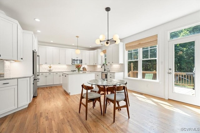 1450 Palmore Rd, Powhatan, VA 23139 - dining room featuring light wood-style flooring, recessed lighting, and a chandelier