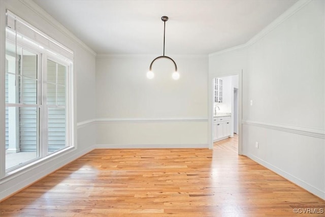 1450 Palmore Rd, Powhatan, VA 23139 - unfurnished dining area featuring light wood finished floors, a chandelier, and crown molding