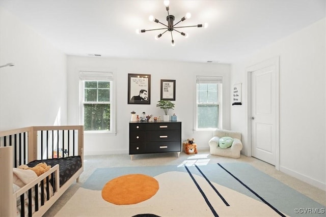 1450 Palmore Rd, Powhatan, VA 23139 - carpeted bedroom with a chandelier and multiple windows