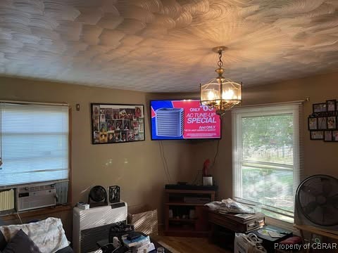 4487 Tidewater Trl, Jamaica, VA 23079 - dining space with a chandelier and cooling unit