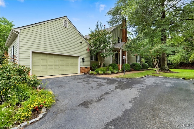 9039 Wood Sorrel Dr, Henrico, VA 23229 - view of front of property with asphalt driveway and a chimney