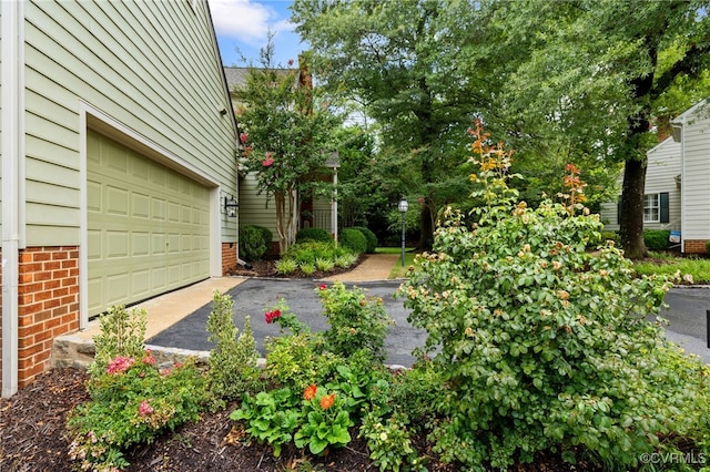 9039 Wood Sorrel Dr, Henrico, VA 23229 - view of yard featuring a garage and driveway