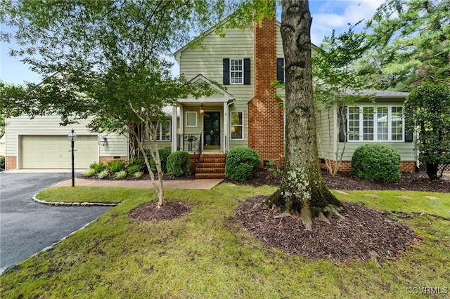 9039 Wood Sorrel Dr, Henrico, VA 23229 - view of front of property with asphalt driveway, an attached garage, crawl space, and a chimney