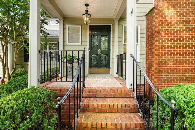 9039 Wood Sorrel Dr, Henrico, VA 23229 - entrance to property with french doors, brick siding, and covered porch
