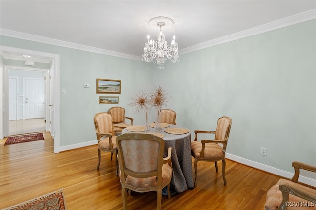 9039 Wood Sorrel Dr, Henrico, VA 23229 - dining space with light wood finished floors, a chandelier, and crown molding