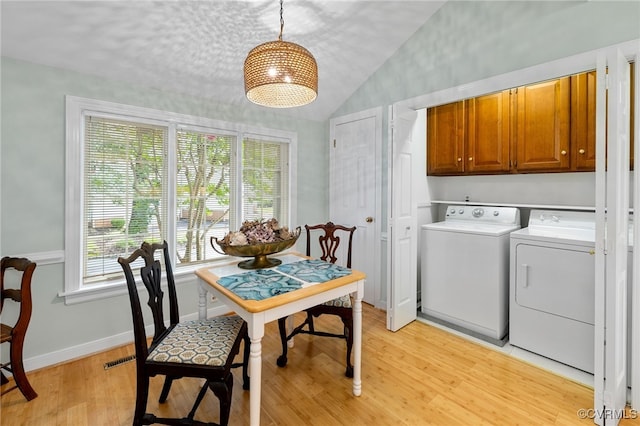 9039 Wood Sorrel Dr, Henrico, VA 23229 - dining room with independent washer and dryer, lofted ceiling, and light wood-type flooring