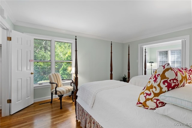 9039 Wood Sorrel Dr, Henrico, VA 23229 - bedroom with multiple windows, wood finished floors, and ornamental molding