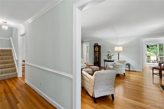 9039 Wood Sorrel Dr, Henrico, VA 23229 - living area featuring crown molding, stairway, and light wood-style floors