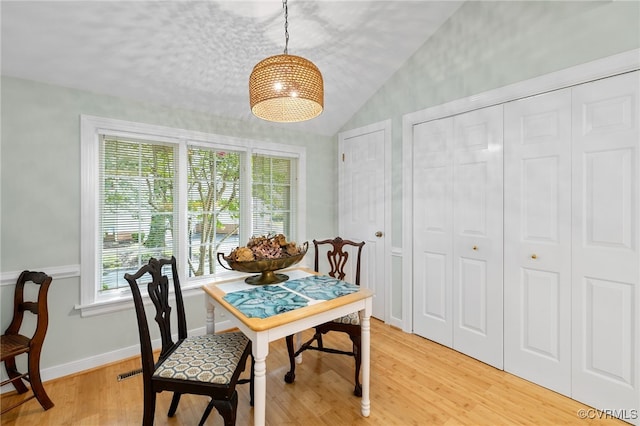 9039 Wood Sorrel Dr, Henrico, VA 23229 - dining area featuring vaulted ceiling and light wood-type flooring