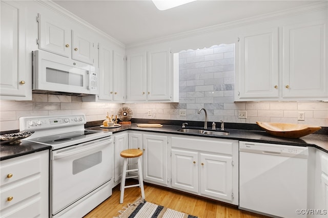 9039 Wood Sorrel Dr, Henrico, VA 23229 - kitchen featuring white appliances, dark countertops, white cabinets, light wood-style floors, and ornamental molding