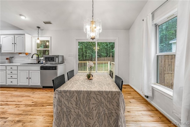 4508 Philips Path, Kents Store, VA 23084 - dining room with light wood-style floors and a chandelier