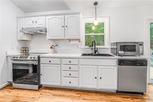 4508 Philips Path, Kents Store, VA 23084 - kitchen with appliances with stainless steel finishes, under cabinet range hood, hanging light fixtures, and white cabinets