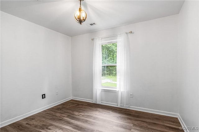 4508 Philips Path, Kents Store, VA 23084 - empty room with a chandelier and dark wood finished floors