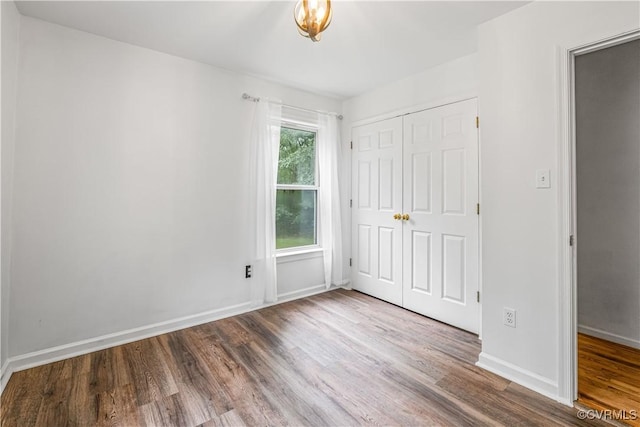 4508 Philips Path, Kents Store, VA 23084 - unfurnished bedroom with wood finished floors and a closet