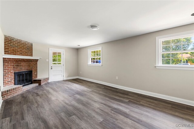 4816 Stornoway Dr, Ampthill, VA 23234 - unfurnished living room with plenty of natural light, dark wood finished floors, and a fireplace