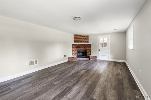 4816 Stornoway Dr, Ampthill, VA 23234 - unfurnished living room with dark wood-style floors and a brick fireplace