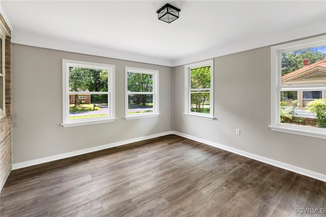 4816 Stornoway Dr, Ampthill, VA 23234 - empty room with plenty of natural light and dark wood-style flooring