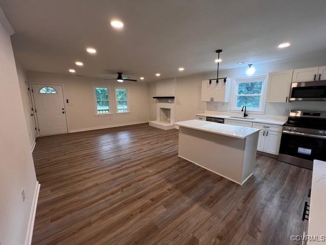 1781 Signboard Rd, Bumpass, VA 23024 - kitchen with stainless steel appliances, white cabinets, light countertops, dark wood-style floors, and recessed lighting