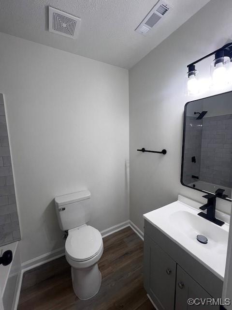 1781 Signboard Rd, Bumpass, VA 23024 - full bathroom with wood finished floors, vanity, shower / washtub combination, and a textured ceiling