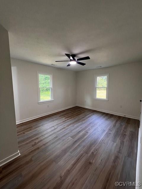 1781 Signboard Rd, Bumpass, VA 23024 - unfurnished room with healthy amount of natural light, dark wood-type flooring, and ceiling fan