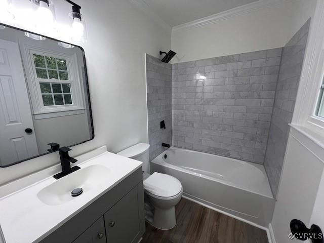 1781 Signboard Rd, Bumpass, VA 23024 - bathroom with vanity, wood finished floors, ornamental molding, tub / shower combination, and healthy amount of natural light