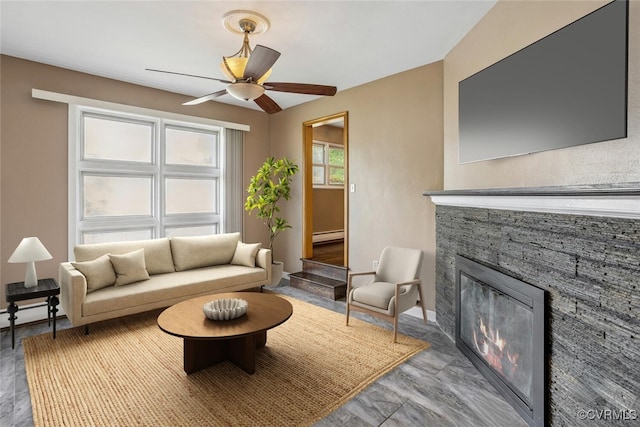 2407 Birchwood Rd, Henrico, VA 23294 - living room featuring a fireplace, a ceiling fan, and a baseboard radiator