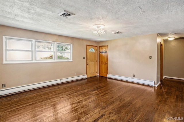 2407 Birchwood Rd, Henrico, VA 23294 - spare room featuring a baseboard heating unit, wood finished floors, a chandelier, and a textured ceiling